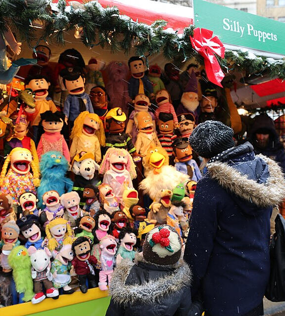 Crowds shopping at the Union Square Holiday Market in NYC during the winter season.